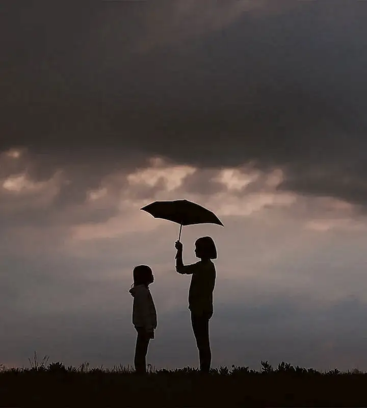 sisters with an umbrella