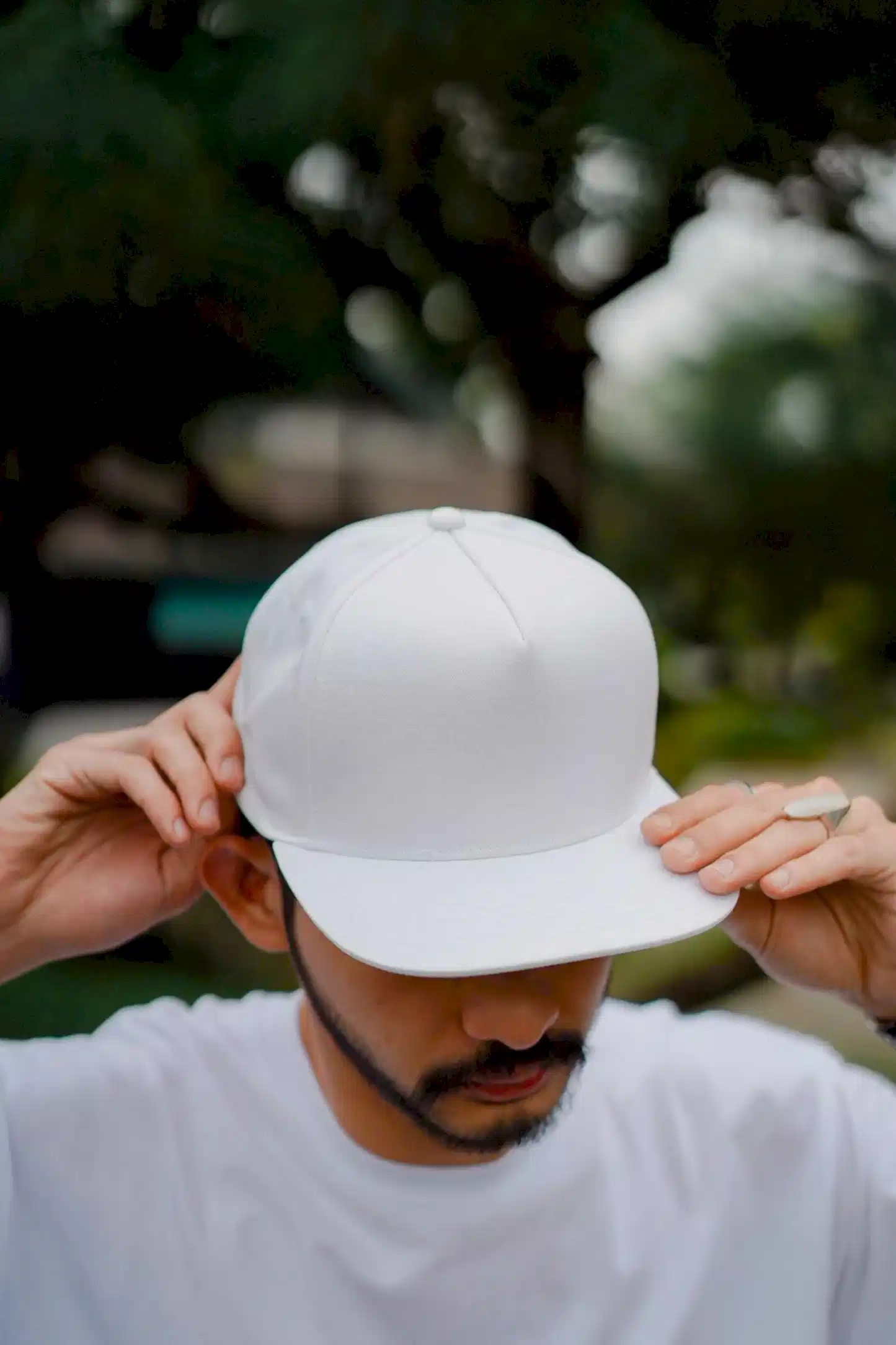 Man wearing a white cap